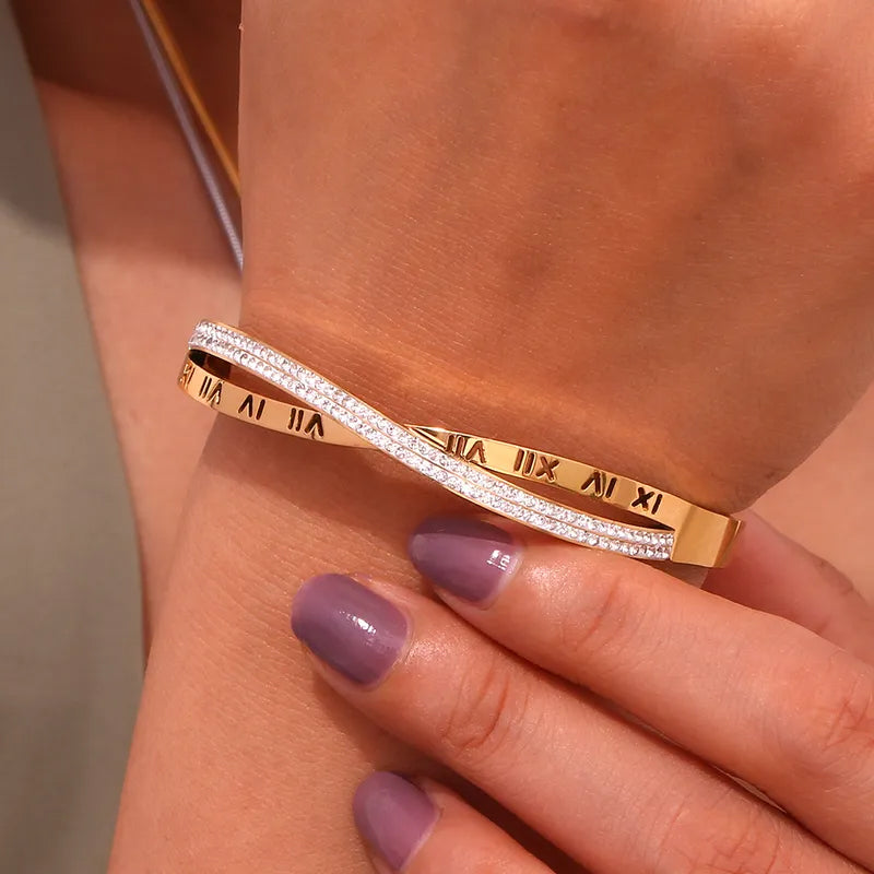 Adora London Athena Bangle 18K fold plated roman numeral detailed bangle with rhinestones in a stainless steel bangle