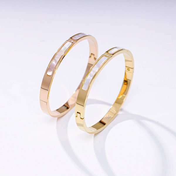 Adora London The Esme Bangle Stainless steel bangle with inlay rhinestones and white marble detailing