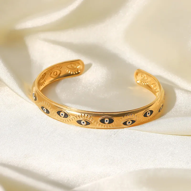 Adora London Medusa bangle Medusa inspired gold plated bangle