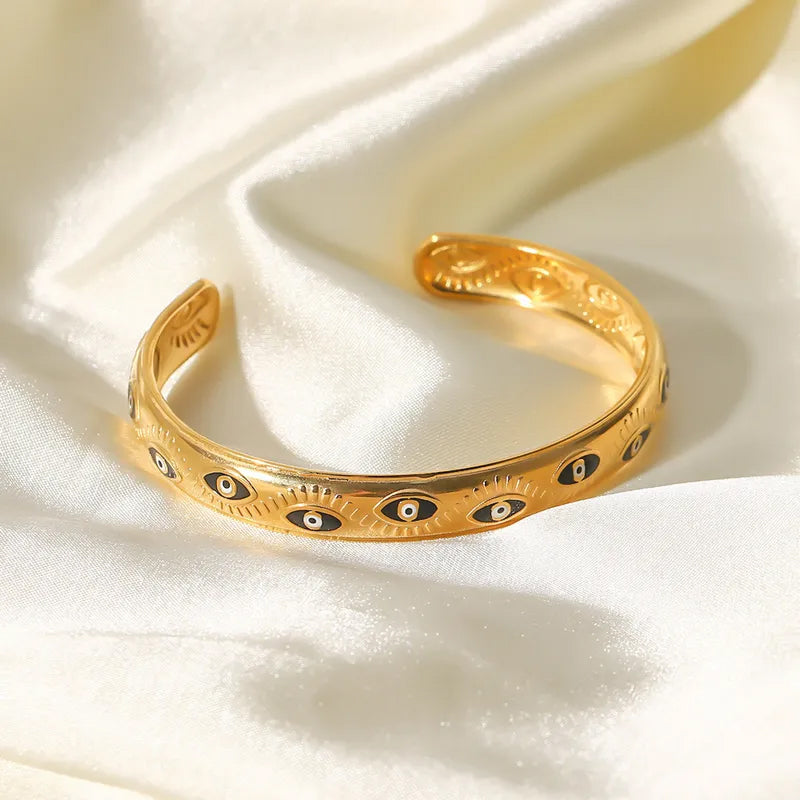 Adora London Medusa bangle Medusa inspired gold plated bangle