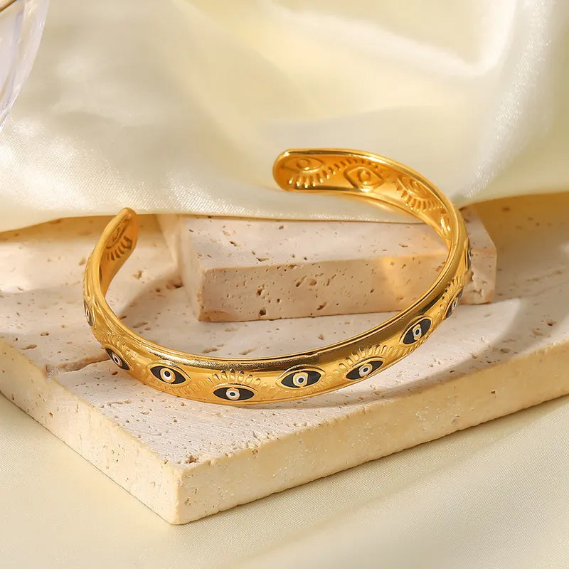 Adora London Medusa bangle Medusa inspired gold plated bangle