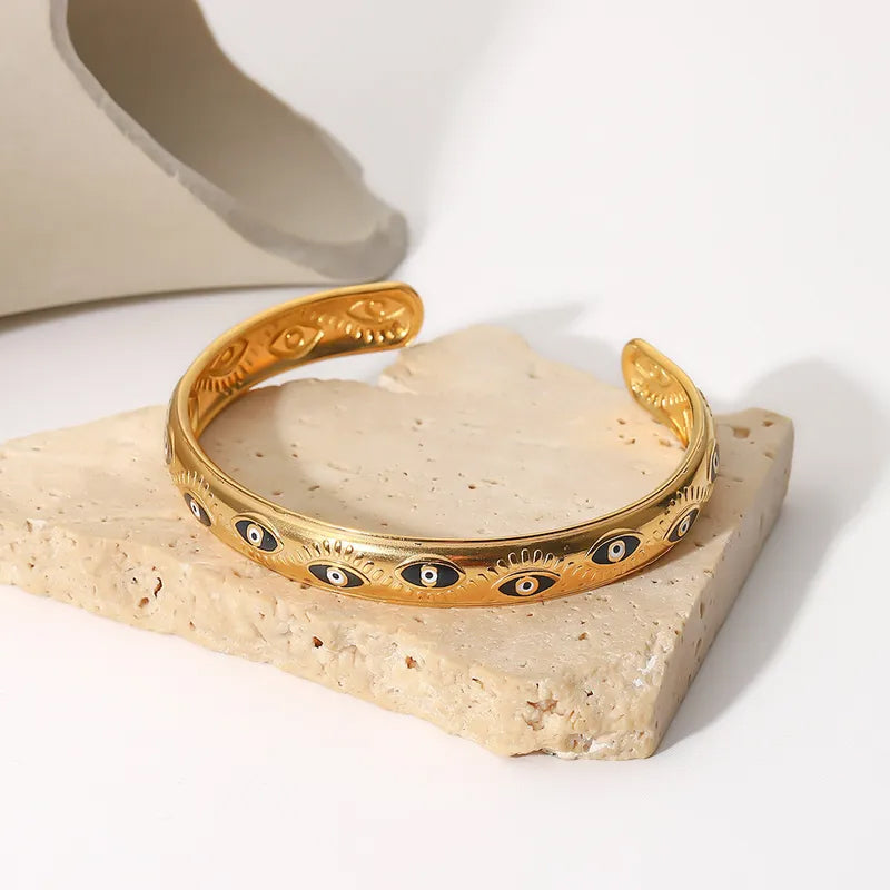 Adora London Medusa bangle Medusa inspired gold plated bangle