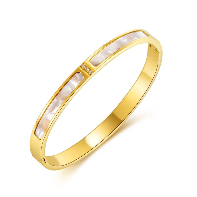 Adora London The Esme Bangle Stainless steel bangle with inlay rhinestones and white marble detailing