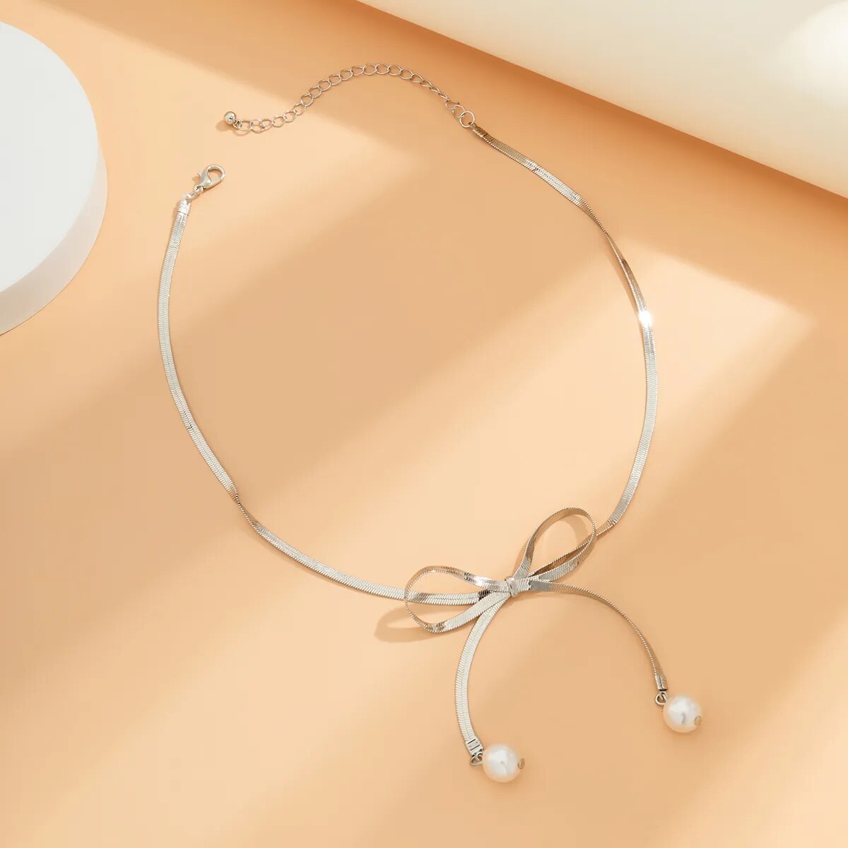 Adora London The Bow Necklace Stainless steel pearl bow detailed necklace