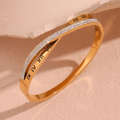 Adora London Athena Bangle 18K fold plated roman numeral detailed bangle with rhinestones in a stainless steel bangle