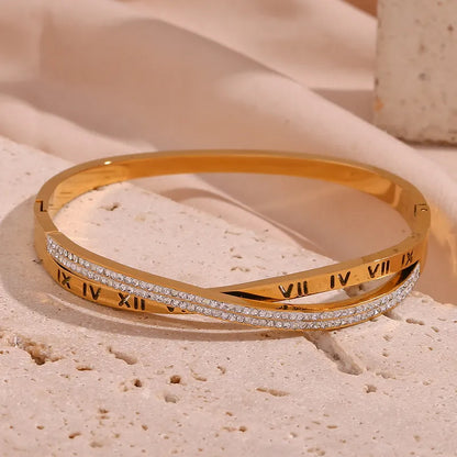 Adora London Athena Bangle 18K fold plated roman numeral detailed bangle with rhinestones in a stainless steel bangle