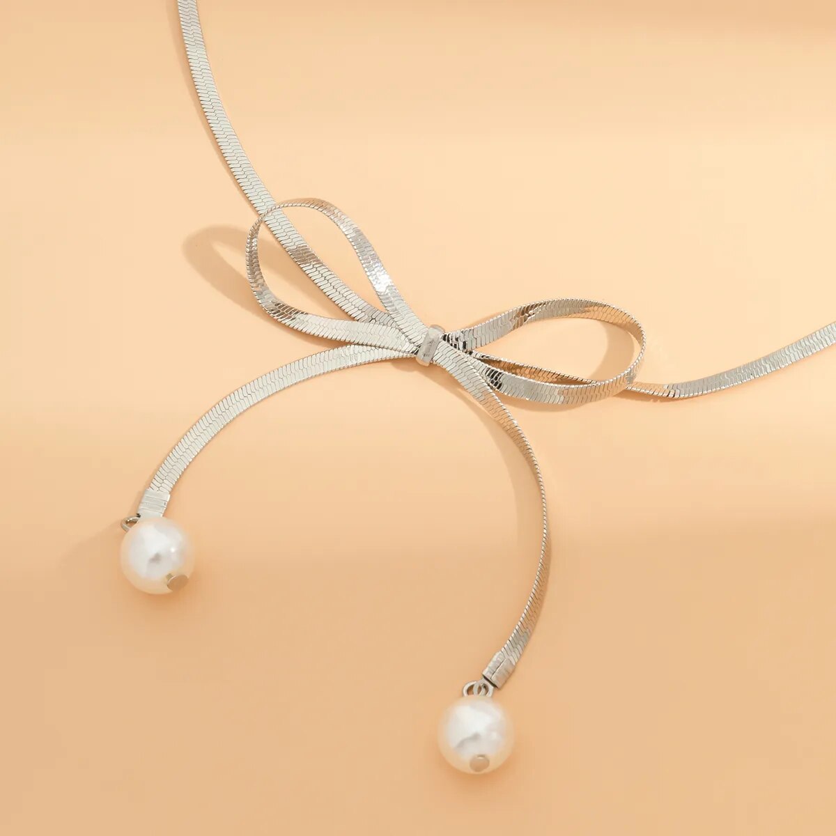 Adora London The Bow Necklace Stainless steel pearl bow detailed necklace
