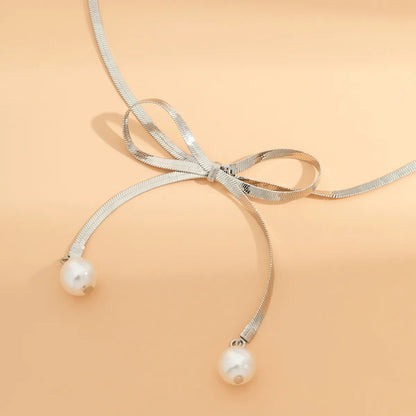 Adora London The Bow Necklace Stainless steel pearl bow detailed necklace